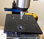 Milling a slot for alignment adjustment in the a-arm mount